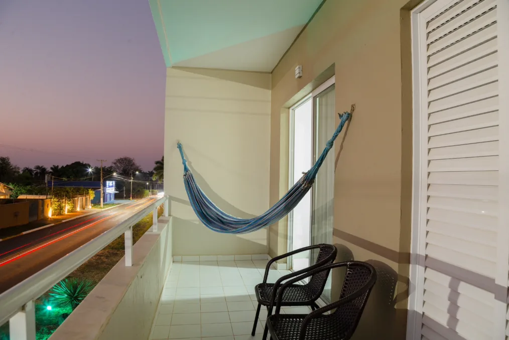 Flat 2 com cama e varanda com rede